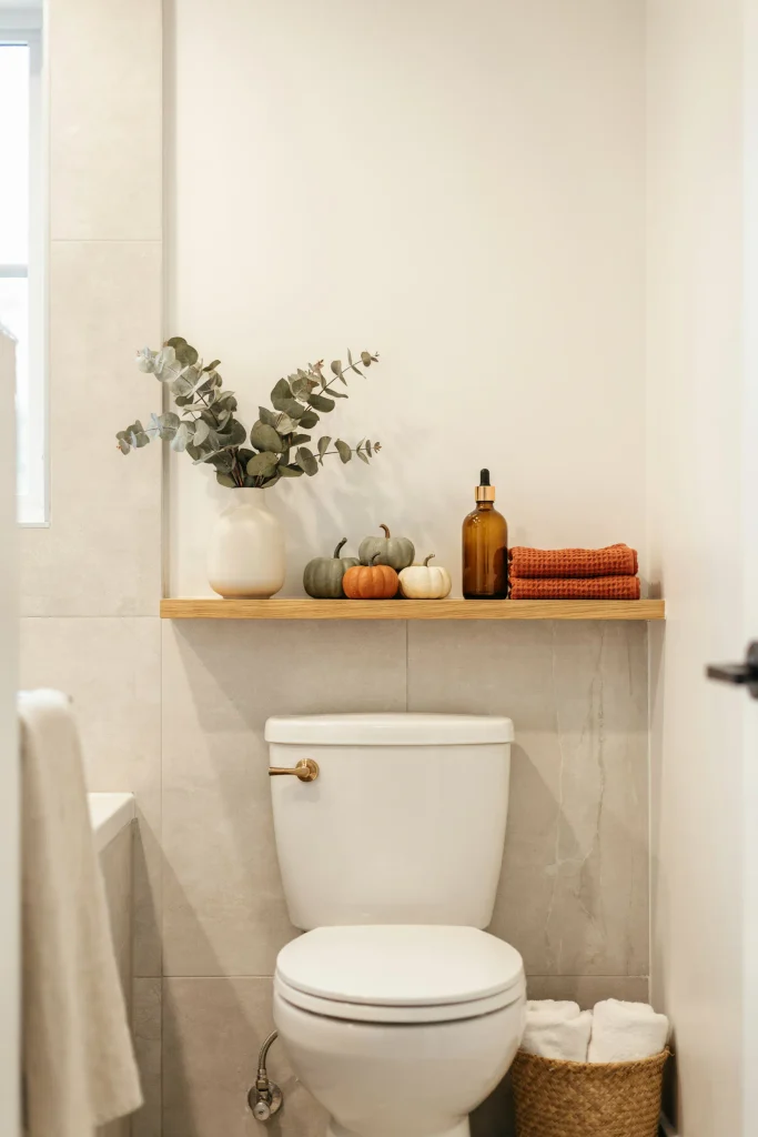 20 Fall Bathroom Decor Ideas for a Cozy Autumn Glow 17 Wooden Accent Shelf