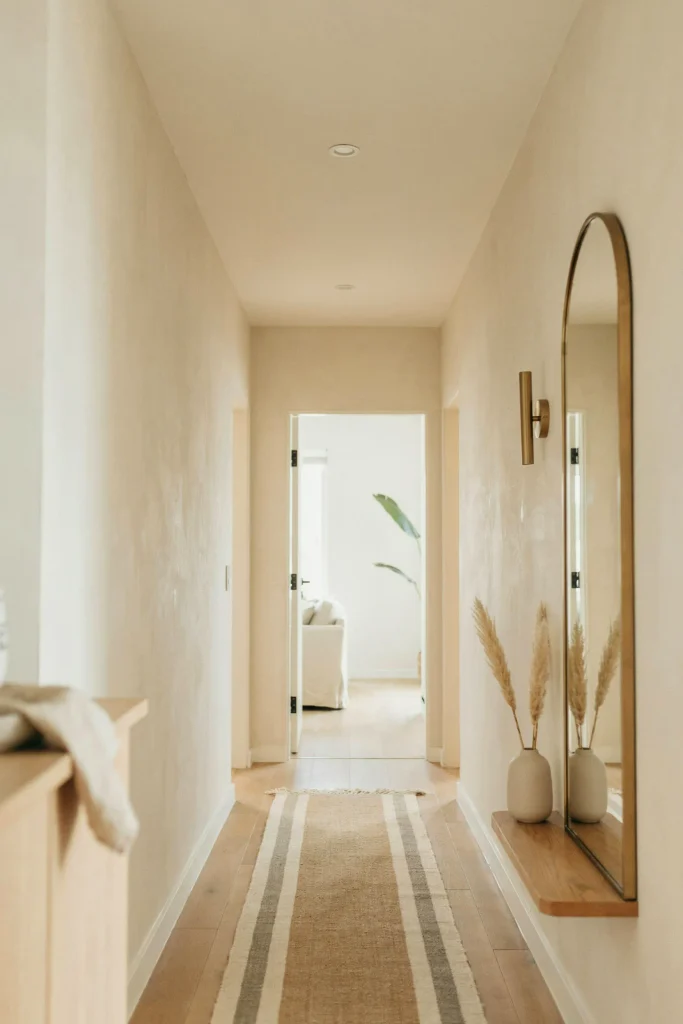 21 Narrow Hallway Decorating Ideas to Try Right Now 13 Arched Mirror Accent
