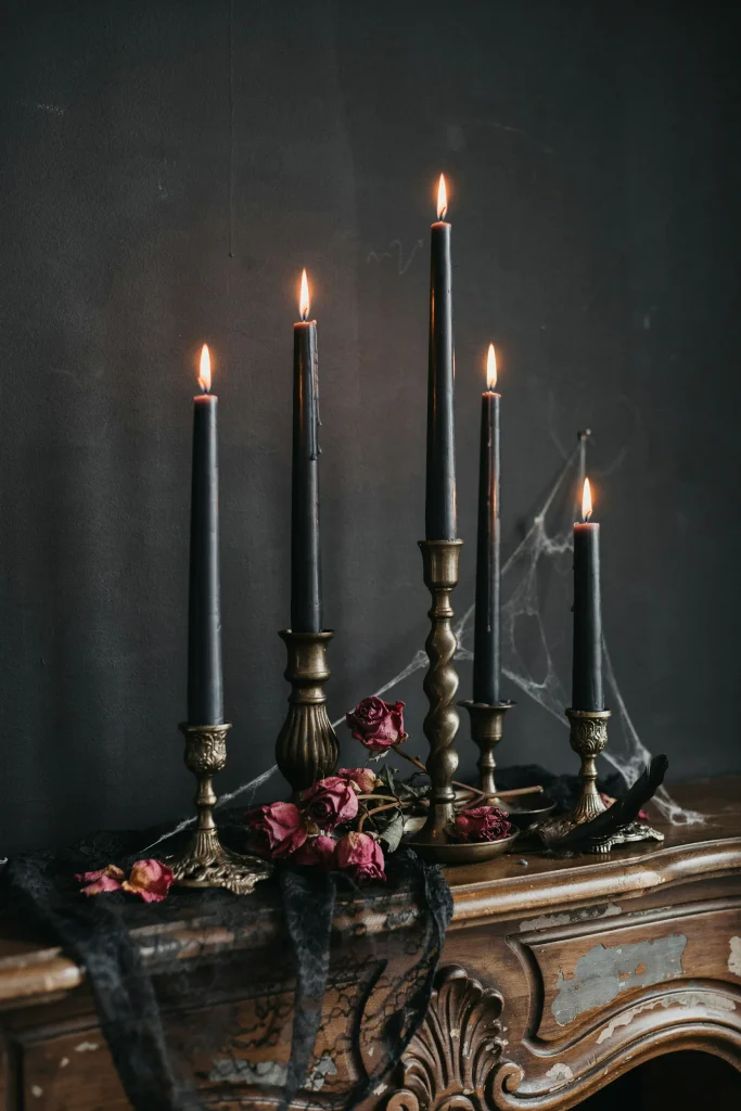 21 Gothic Halloween Decor Ideas for a Haunting 2026 2 Black Candle Cluster