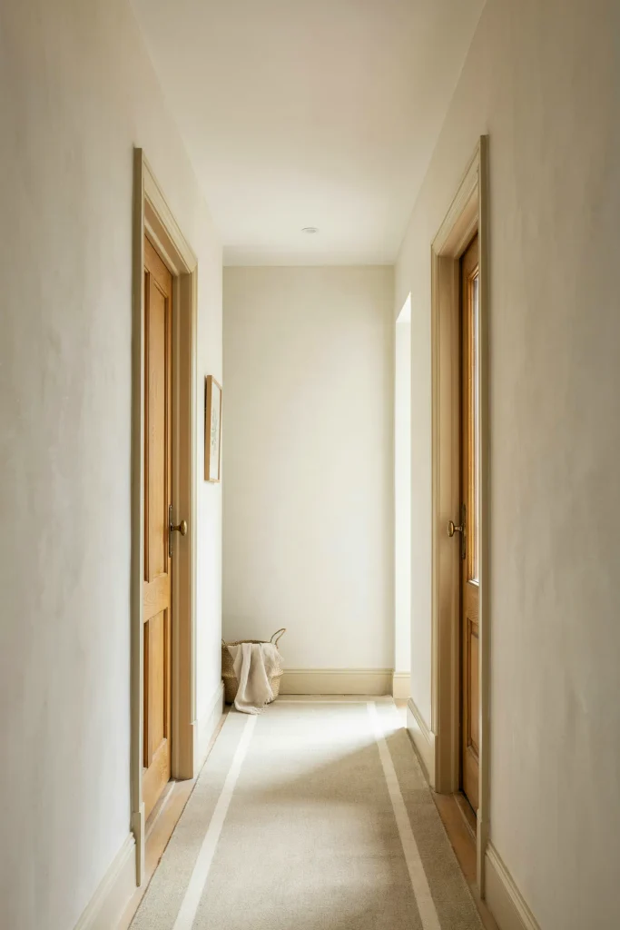 21 Narrow Hallway Decorating Ideas to Try Right Now 7 Painted Door Trim