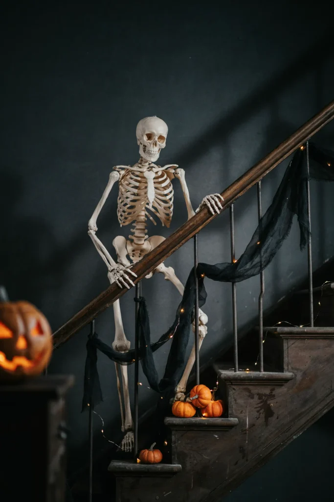 21 Skeleton Halloween Decor Ideas for a Chilling 2026 8 Skeleton Staircase Climber