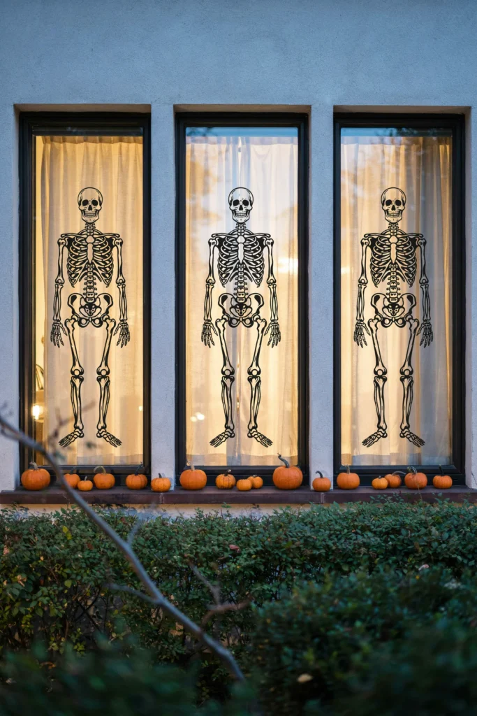 21 Skeleton Halloween Decor Ideas for a Chilling 2026 10 Skeleton Window Silhouettes