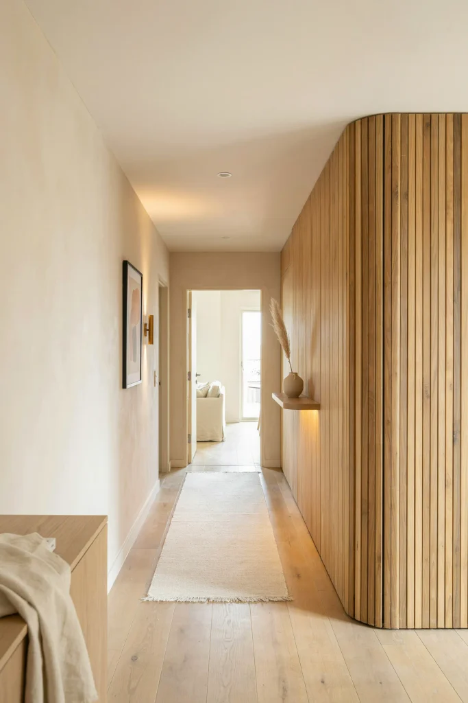 21 Narrow Hallway Decorating Ideas to Try Right Now 14 Vertical Slat Paneling